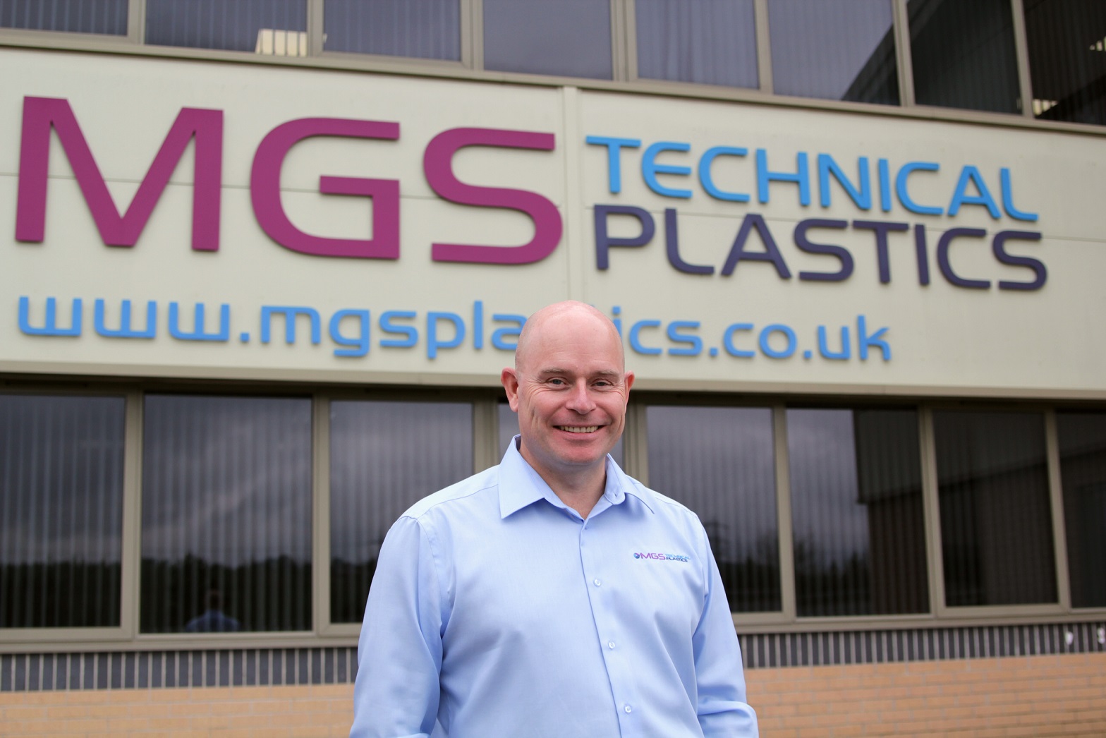 Mark Preston, Sales Director, standing in front of MGS Technical Plastics Ltd.