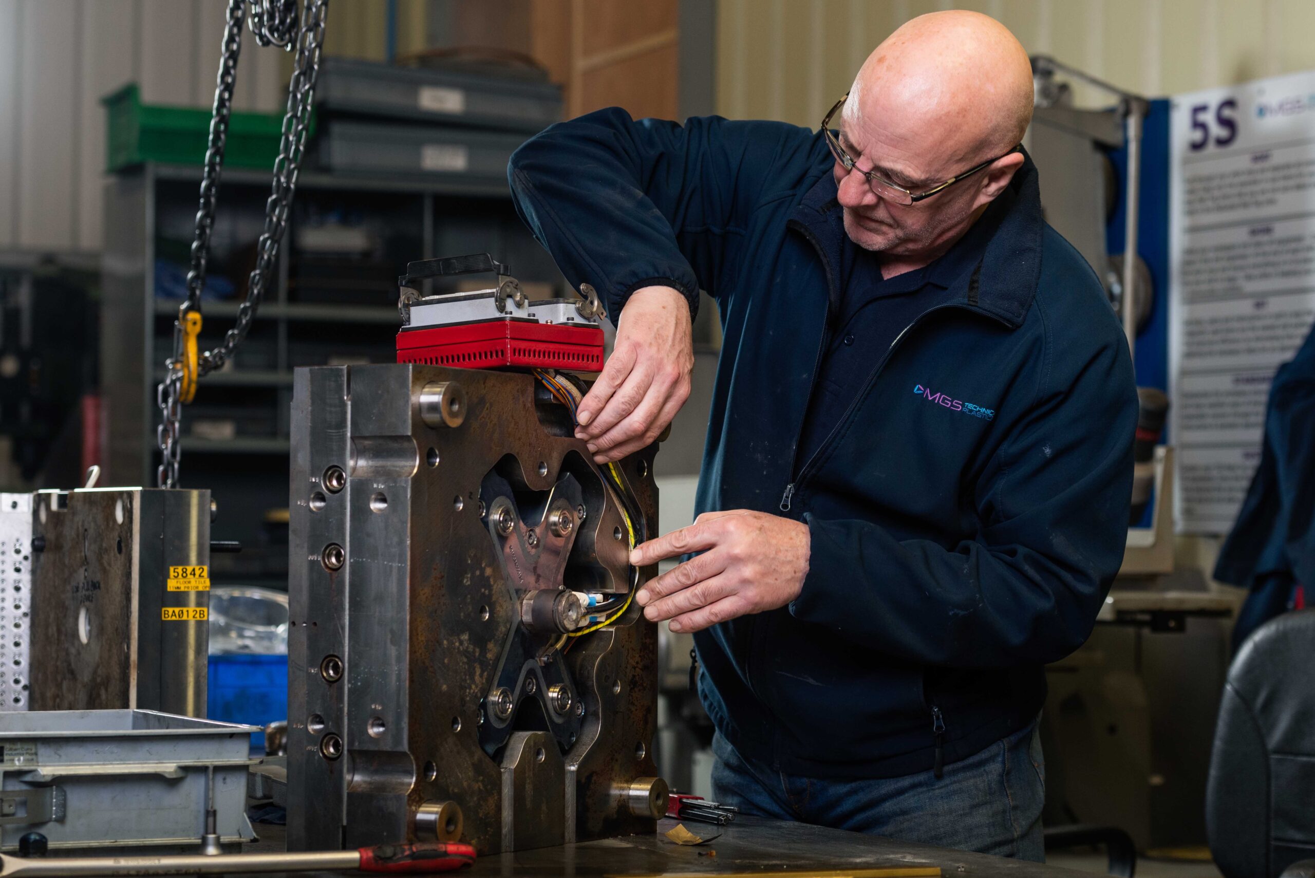 Engineer looking at a tool in the MGS Tool room