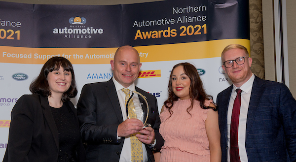 The MGS Team holding the NAA Award