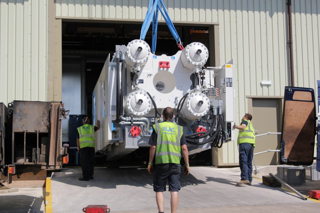 An Injection Moulding being moved into the MGS Building