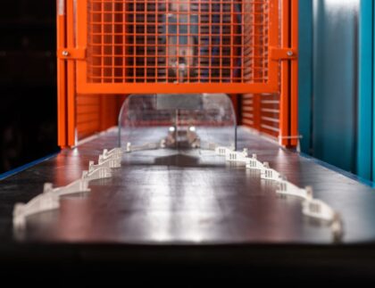 Plastic components on conveyor belt