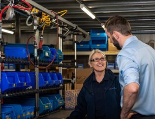 Two employees on product assembly line